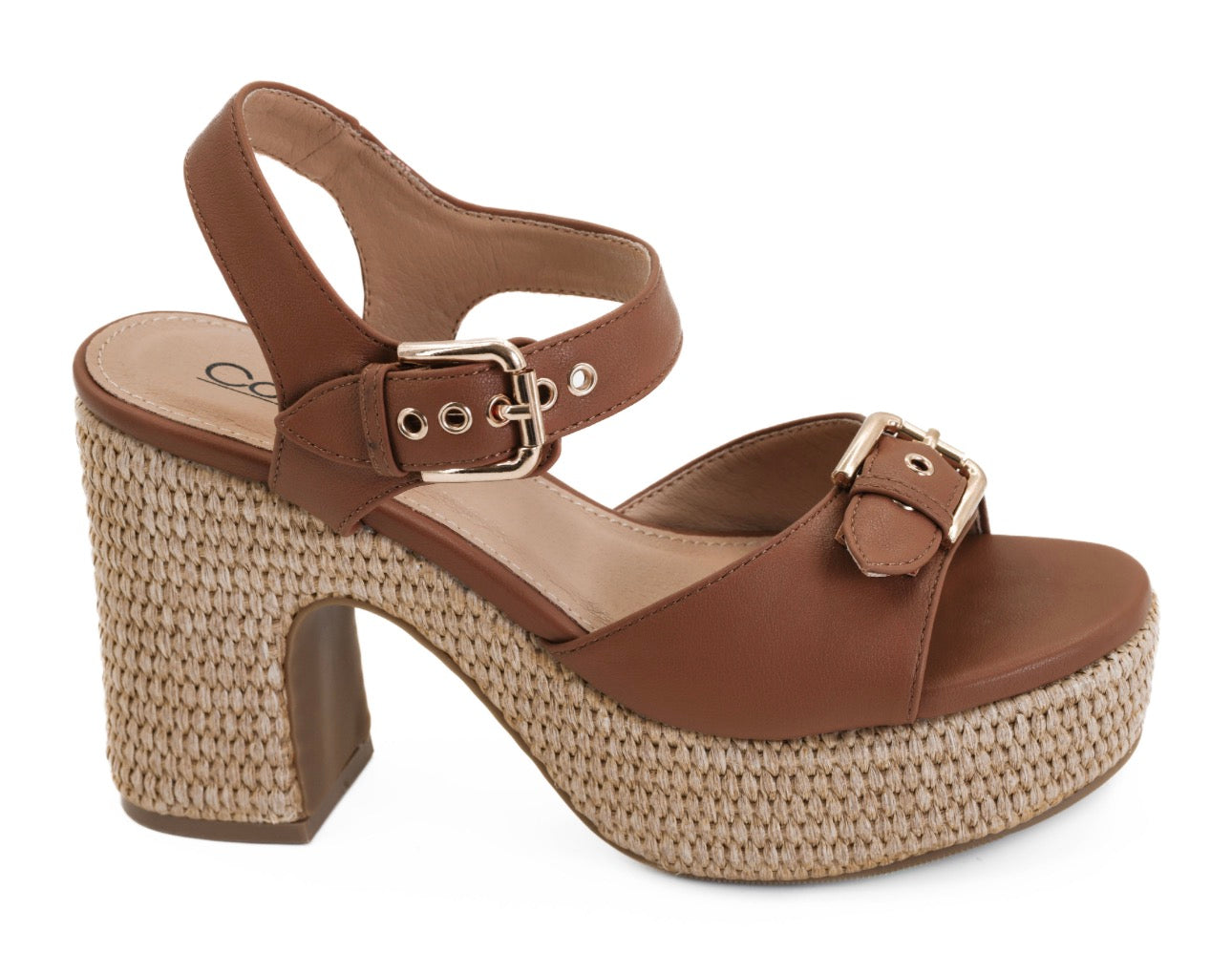 Brown platform sandal with woven sole on a white background